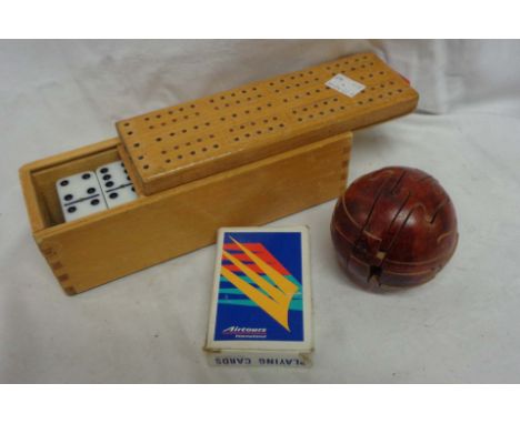 A vintage box set of plastic dominoes with crib board lid - sold with a 3-D cricket ball jigsaw, and a pack of playing cards