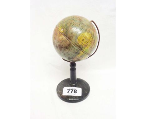 A miniature early 20th Century tin plate globe