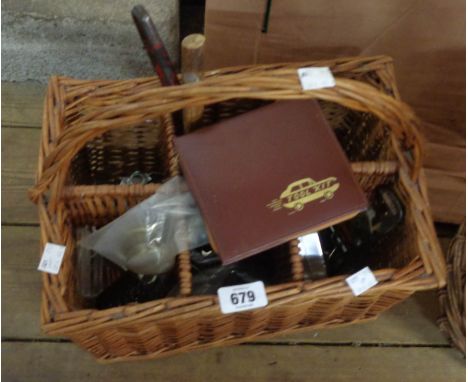 A bottle basket containing assorted tools