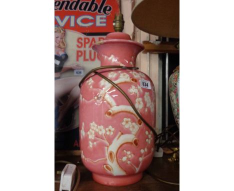 A pink and white temple jar style lamp