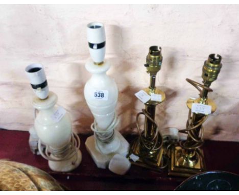 A pair of brass candlestick style table lamps - sold with two alabaster table lamps