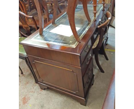 A 1.38m reproduction mahogany twin pedestal desk with leather inset top and three frieze drawers over six flanking pedestal d