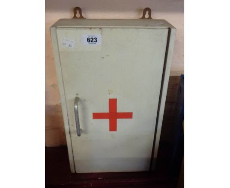 A small wooden First Aid cabinet