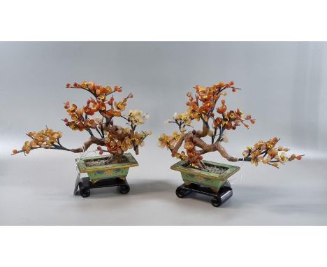 Mirror matched pair of hardstone Bonsai studies, most likely Chinese, both contained in Canton enamel style planters.  19cm h