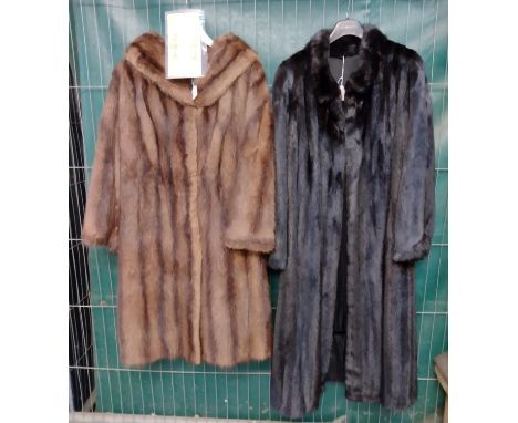 Two vintage fur coats; one is black ranch mink fur with silky lining and guarantee from Sovereign furs and a National Fur Com