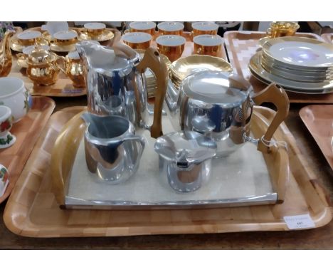 Picquot ware four piece coffee and tea service on matching tray; coffee pot, teapot, lidded sucrier and milk jug. (B.P. 21% +