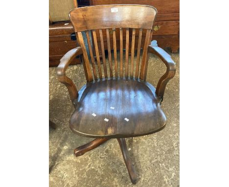 Mid 20th century beech stick backed office capstan elbow chair.    (B.P. 21% + VAT) 