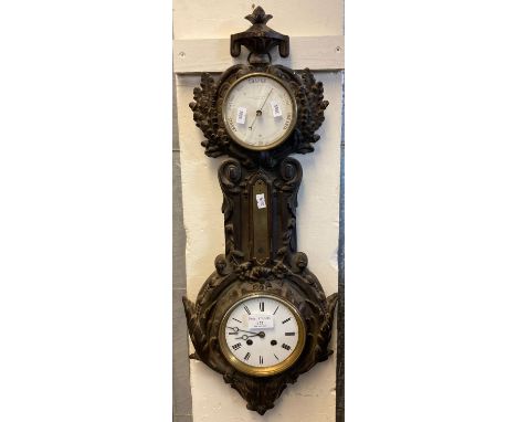 Late Victorian cast iron aneroid barometer marked J. J. Wainwrighte &amp; Co. Birmingham, with two train clock having enamel 