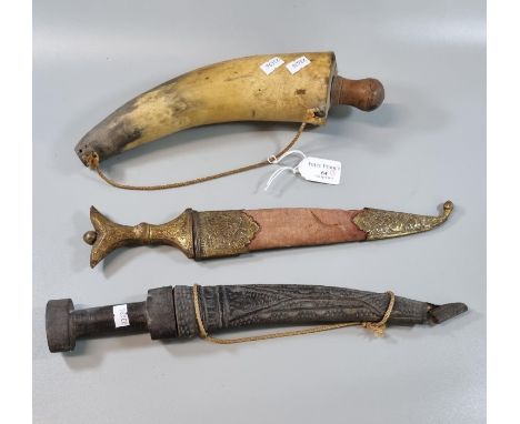 Horn powder flask with turned wooded handle together with two Middle Eastern daggers, one with yellow metal scabbard, the oth