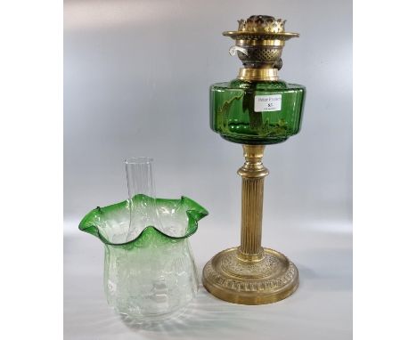 Early 20th century double oil burner lamp having green clear and frosted etched foliate shade above a green reservoir standin