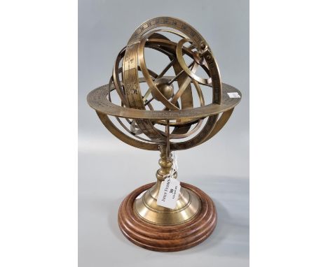 Reproduction brass Armillary Sphere globe on pedestal base with wooden plinth. 28cm high approx. (B.P. 21% + VAT)  No obvious