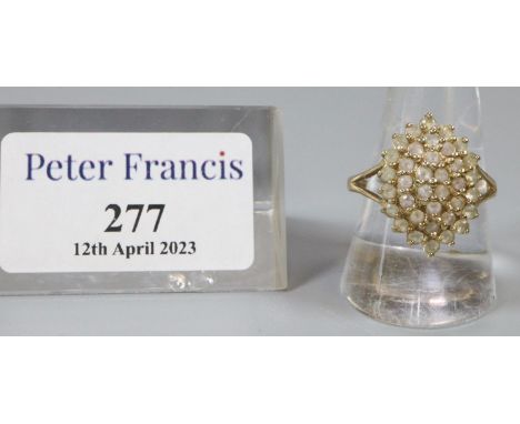 9ct gold dress ring set with a cluster of white stones.  Ring size R&1/2.  Approx weight 4.6 grams.(B.P. 21% + VAT) 