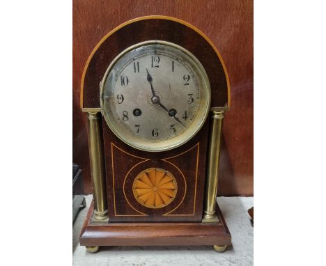Edwardian inlaid mahogany two train mantle clock with Arabic face, satinwood inlaid decoration and brass pillars on brass fee