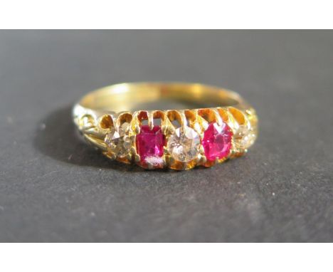 An Yellow Gold, Ruby and Diamond Five Stone Ring, size Q.5, 4.2g 