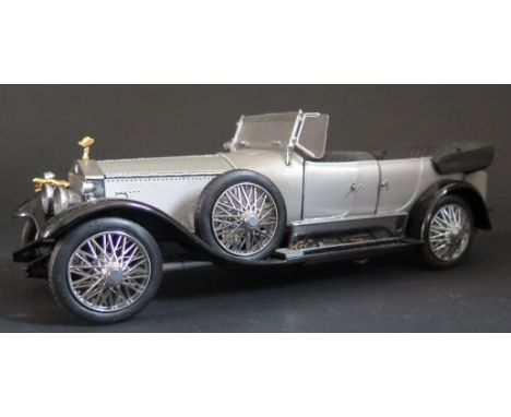 A Franklin Mint 1925 Rolls Royce The Last Silver Ghost. Appears in excellent displayed condition in box. 