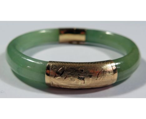 A Chinese Jadeite and 18K Gold Hinged Bangle