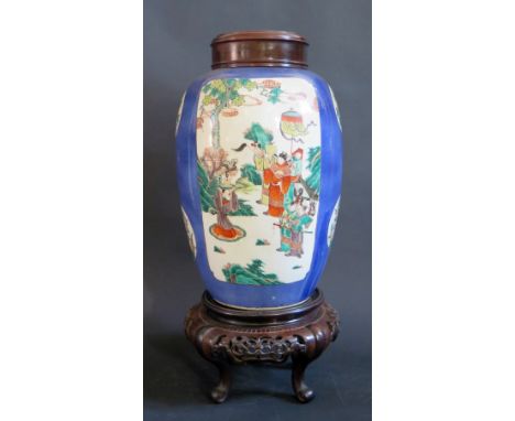 A Nineteenth Century Chinese Famille Verte Vase decorated with two panels of Eminent Figures on a blue ground and two floral 