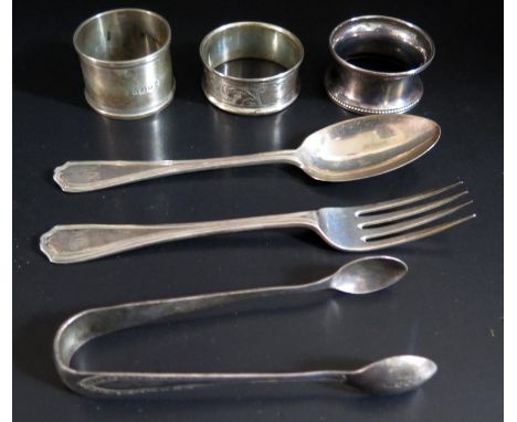 A George V Silver Christening Spoon and Fork London 1924 D.F, three silver napkin rings and pair of sugar tongs, 117g 