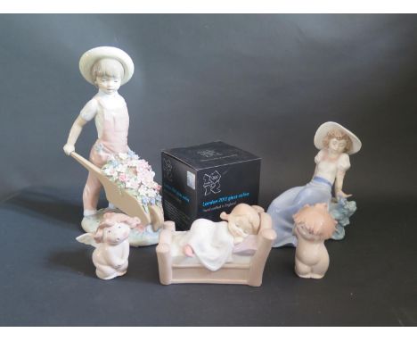 A Lladro Figurine, Four Boxed Nao Figurines and London 2012 Glass Votive 