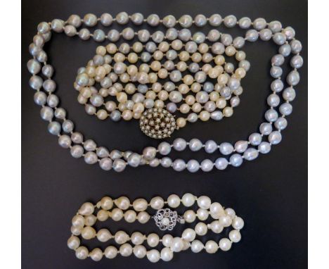 A Pearl Necklace with 9ct Gold Clasp with alternating South Sea pearls (100cm), one other with silver clasp and South Sea pea