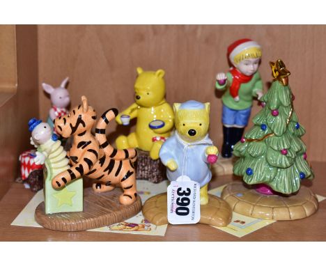 SIX ROYAL DOULTON WINNIE THE POOH CHARACTER FIGURESAND A RELATED ITEM, comprising three from The Christmas Collection 'A Litt