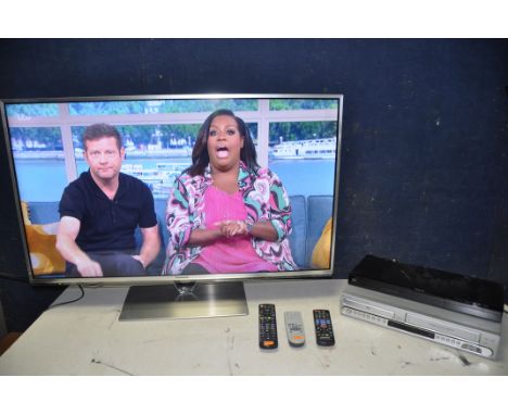 A PANASONIC TX-L42ET61B 42in TV with remote along with a Panasonic DMP-BDT130 Blu-ray player and a PYE PDV560VR vhs/DVD recor