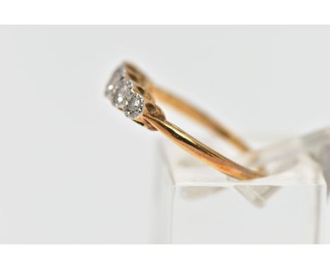 A MID 20TH CENTURY PLATINUM AND 18CT YELLOW GOLD DIAMOND FIVE STONE RING, set with graduating diamonds, to include three earl