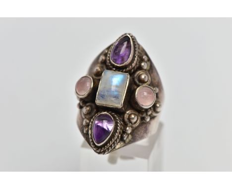 A GEM SET RING, a white metal dress ring, set with a cabochon moonstone centre stone, with additional cabochon rose quartz an