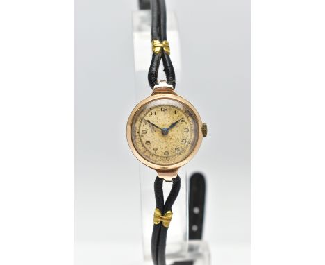 A 1940s 9CT YELLOW GOLD MANUAL WIND WRISTWATCH, the circular gold tone dial, with black Arabic numerals, blue steel hands, ci