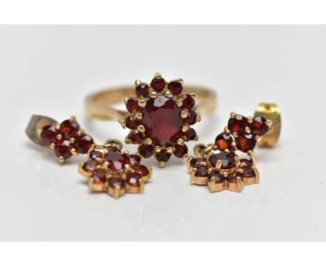 A 9CT GOLD GARNET RING AND EARRINGS, a cluster ring designed as an oval cut garnet, set with twelve circular cut garnets lead