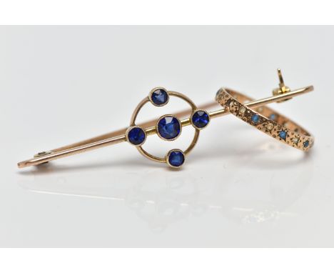 AN EARLY 20TH CENTURY GOLD BAR BROOCH AND YELLOW METAL RING, the first a yellow gold openwork bar brooch set with five circul