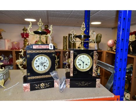 TWO LATE 19TH CENTURY BLACK SLATE MANTEL CLOCKS, both with enamel dials, Arabic numerals, 8 day movements and bell strikes, t