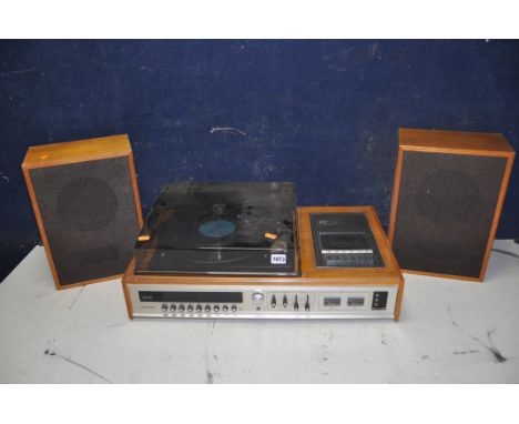 A CARLTONE 7000 MUSIC CENTRE with radio/cassette and record player along with two unbranded speakers (PAT pass and working)