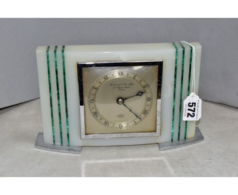 A GARRARD &amp; Co ONYX AND MALACHITE MANTLE CLOCK, the chapter ring having roman numerals, the centre of the dial having Gar