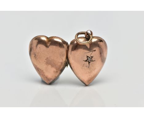 A LATE 19TH CENTURY GOLD LOCKET,  a rose gold front and back locket of heart form, set with a single rose cut diamond, engrav