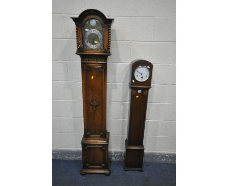 A 20TH CENTURY OAK CASED CHIMING GRANDAUGTHER CLOCK, the hood with barley twist pillars, flanking a glazed door, enclosing an