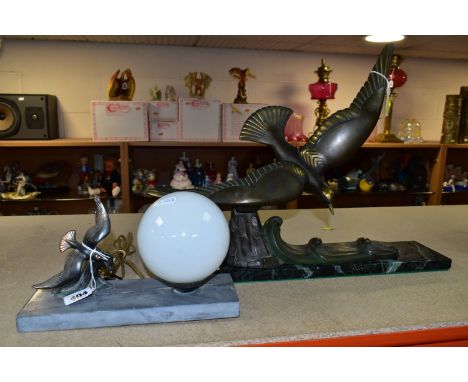 A BRONZED ART DECO SEA GULL, on a mottled green and black marble base, the bird is detachable, height 38cm, length 44cm, toge