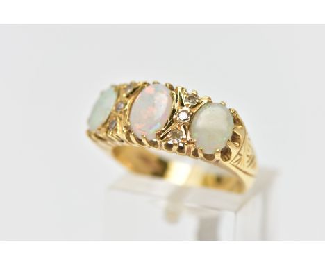 AN OPAL AND DIAMOND RING, set with three oval opal cabochons, interspaced by six single cut diamond spacers, estaimted total 