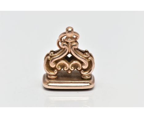 A 9CT GOLD FOB SEAL, of a rounded rectangular form, set with a polished carnelian panel to the base, scroll detailed mount wi
