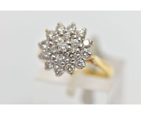A MODERN 18CT GOLD DIAMOND CLUSTER RING, set with a total of nineteen round brilliant-cut diamonds, measuring from approximat