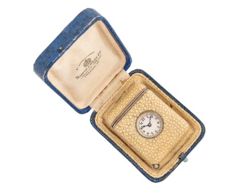 A SILVER AND SHAGREEN RECTANGULAR FOLDING PURSE WATCHThe unsigned silvered dial with black Arabic numerals and blue steel han