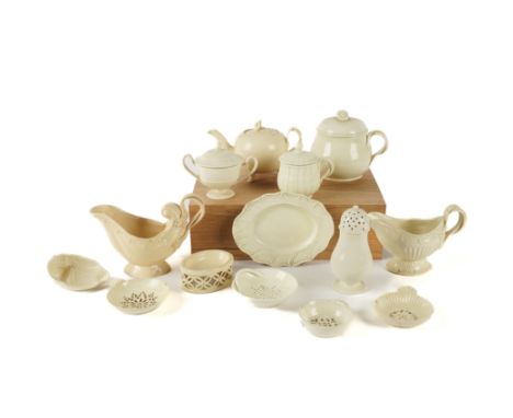A GROUP OF PLAIN CREAMWARE (20)Late 18th/early 19th century
Two moulded sauceboats; a small bullet-shaped teapot and cover, 1