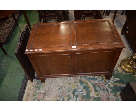 An oak blanket box with original purchase receipt and key dated 1934; an oak firescreen 