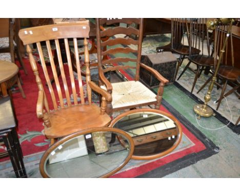 A country cottage elm and yew rocking chair; a ladder back rush seat armchair; two framed wall mirrors (4) 