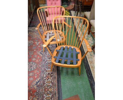 A pair of Ercol Windsor armchairs.