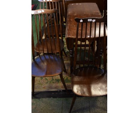 Four Ercol spindle back chairs and an oak drop leaf dining table (5) 