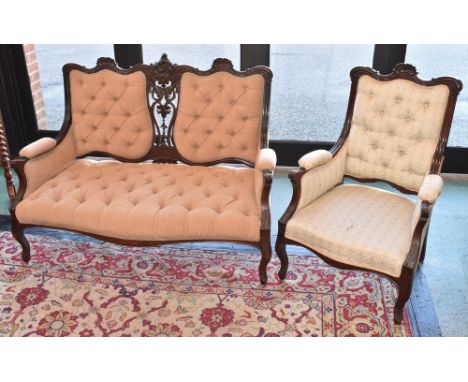 An Edwardian mahogany two seat salon sofa, cresting toop rail, button upholstery, cabriole fore legs; conforming armchair (2)