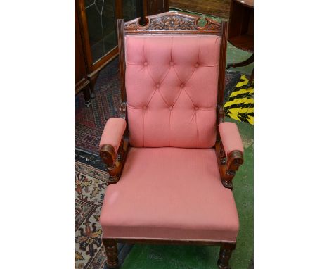 A Victorian salon side chair, rectangular button back, carved shaped cresting rails, stuffed-over seat, turned legs, c.1890
