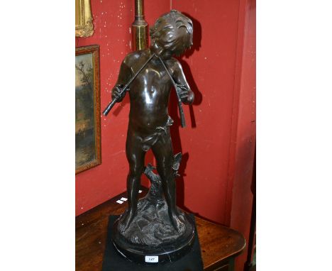 After Louis Auguste Moreau, a dark patinated bronze, Pan, stood playing a pair of pipes, signed in the maquette, circular noi