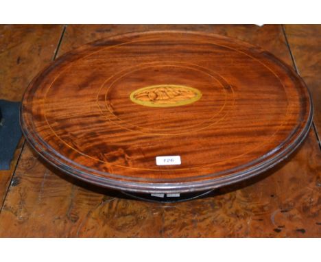 A George III mahogany circular Lazy Susan, moulded oversailing dished top centred by a shell patera within alternating boxwoo